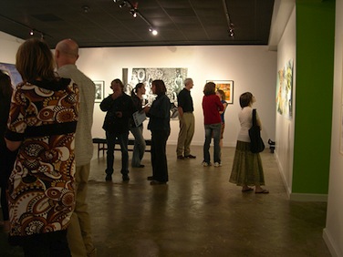 Patrons viewing art at the gallery.